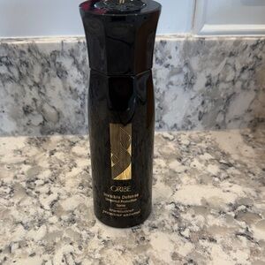 Oribe Invisible Defense Spray in Black and Gold